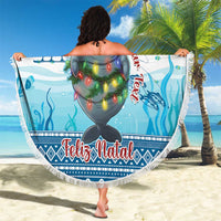 Round beach blanket held as wrap, manatee in Santa hat with colorful lights, Feliz Natal