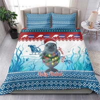 Blue Christmas bedding set with manatee and ocean waves, matching pillow design
