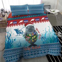 Blue Christmas bedding set featuring a manatee in holiday lights and ocean patterns