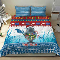Blue Christmas bedding set with manatee graphic, ocean waves, and 'Feliz Natal' band