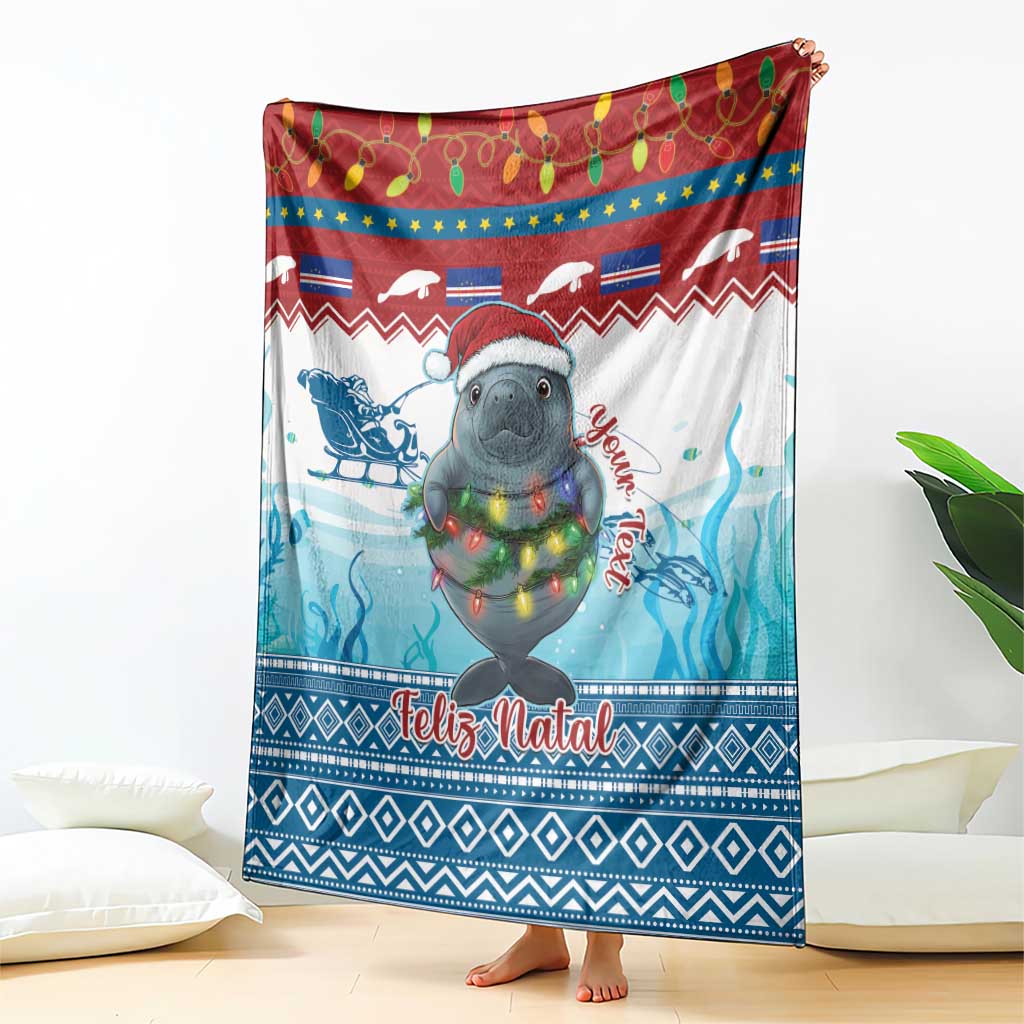 Blue and red Christmas blanket featuring a manatee with festive lights and “Feliz Natal”