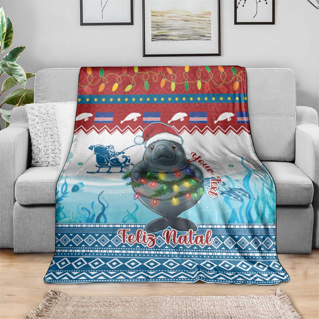 Blue Christmas throw blanket with manatee graphic, festive lights, and “Feliz Natal”