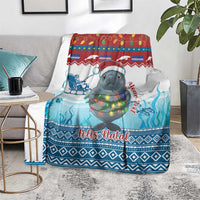Blue Christmas blanket with manatee holding a lights garland and “Feliz Natal” message