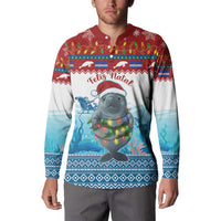 Men's red and blue button sweatshirt worn by model, festive seal with glowing lights