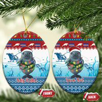 Blue ceramic oval ornaments with manatee and glowing lights, “Feliz Natal” and “Your Text”