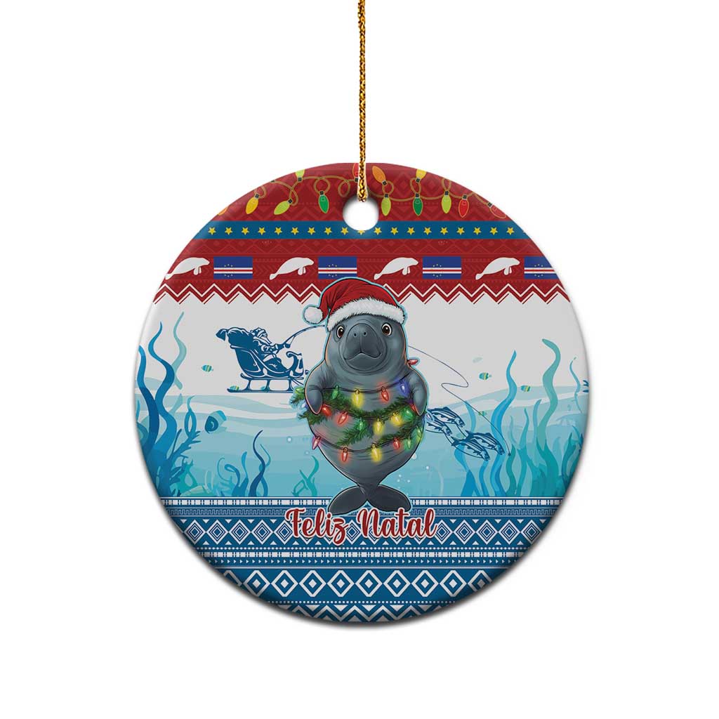 Blue ceramic round ornament with manatee holding glowing lights, “Feliz Natal” text