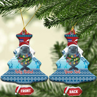 Blue ceramic Christmas tree-shaped ornament with manatee and glowing lights, “Feliz Natal”