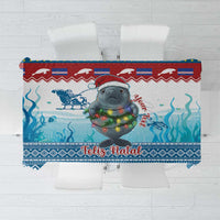 Blue Christmas tablecloth with manatee illustration and Feliz Natal text, patterned border