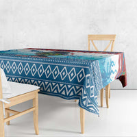 Blue Christmas tablecloth with geometric trim and manatee graphics, corner drape
