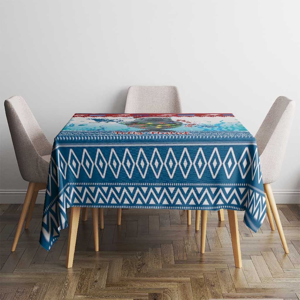 Blue geometric tablecloth with manatee artwork, square top drape on dining table