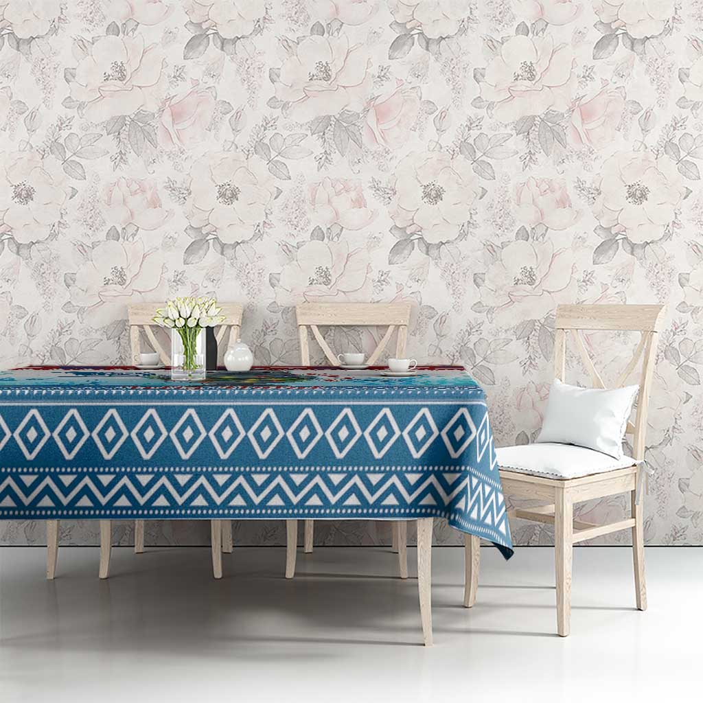 Blue geometric Christmas tablecloth on dining table with zigzag border design