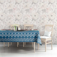 Blue geometric Christmas tablecloth on dining table with zigzag border design