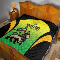 Yellow-green Jamaican jersey graphic quilt on black bedding with custom text, quilted pattern