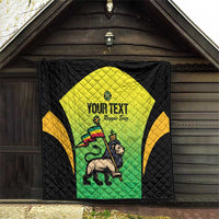 Black quilt hanging on wall with yellow-green Jamaican jersey graphic and custom text, quilted