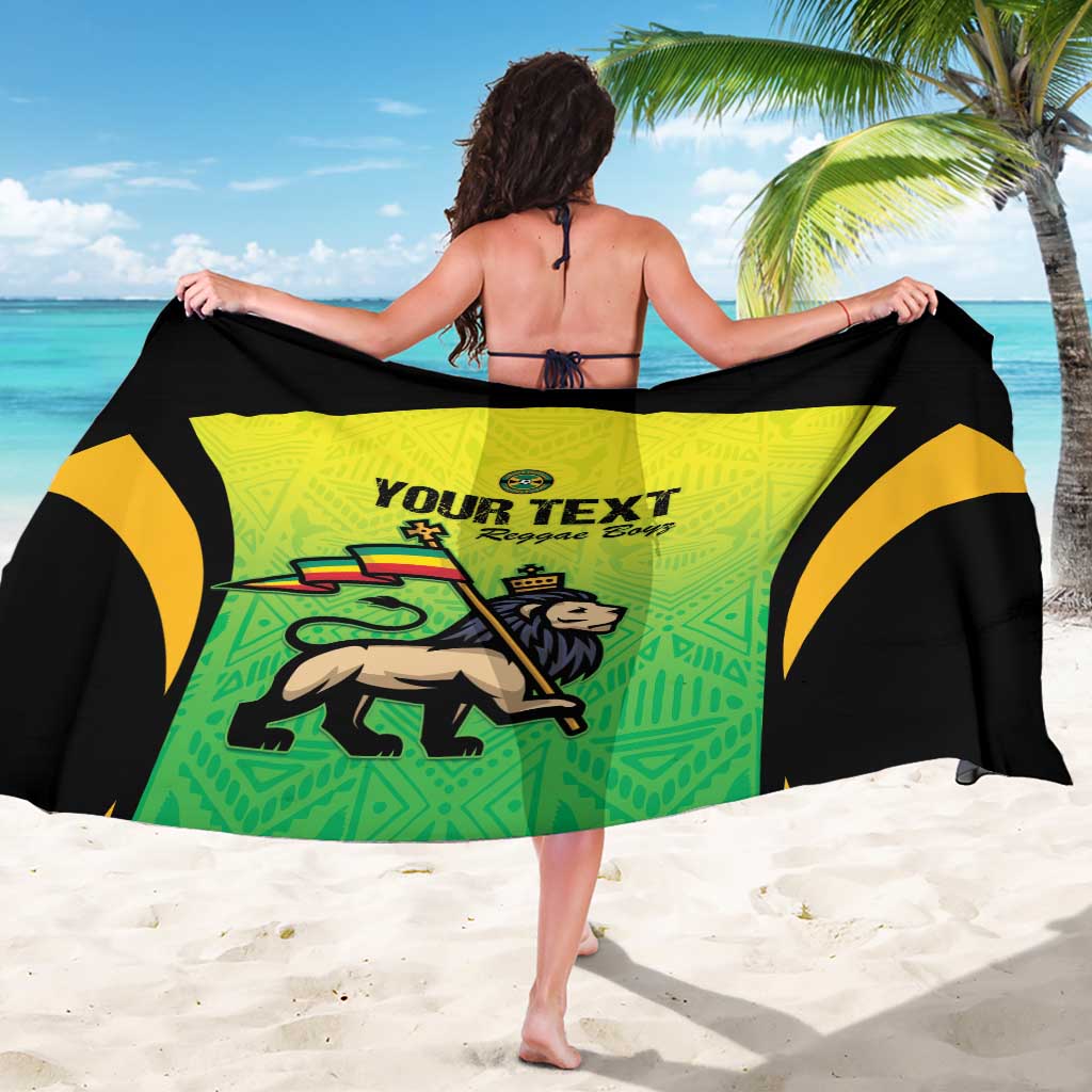 Green and black sarong with yellow accents, “Your Text” print, and reggae dancer graphic