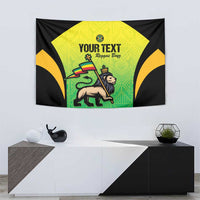 Wall tapestry with black borders, green-yellow panel, lion artwork, and 'YOUR TEXT'