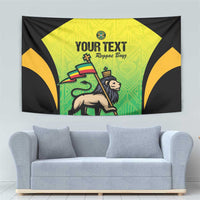 Wall tapestry with black frame, green-yellow panel, lion figure, and 'YOUR TEXT' text