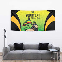 Black and green tapestry with yellow arch design, lion graphic, and 'YOUR TEXT' print