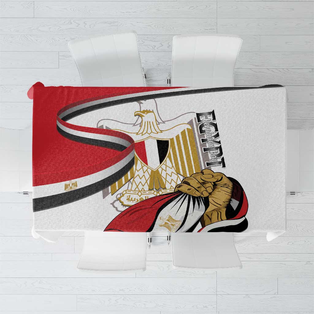 White tablecloth with Egyptian emblem and flag design in red, black, and gold.