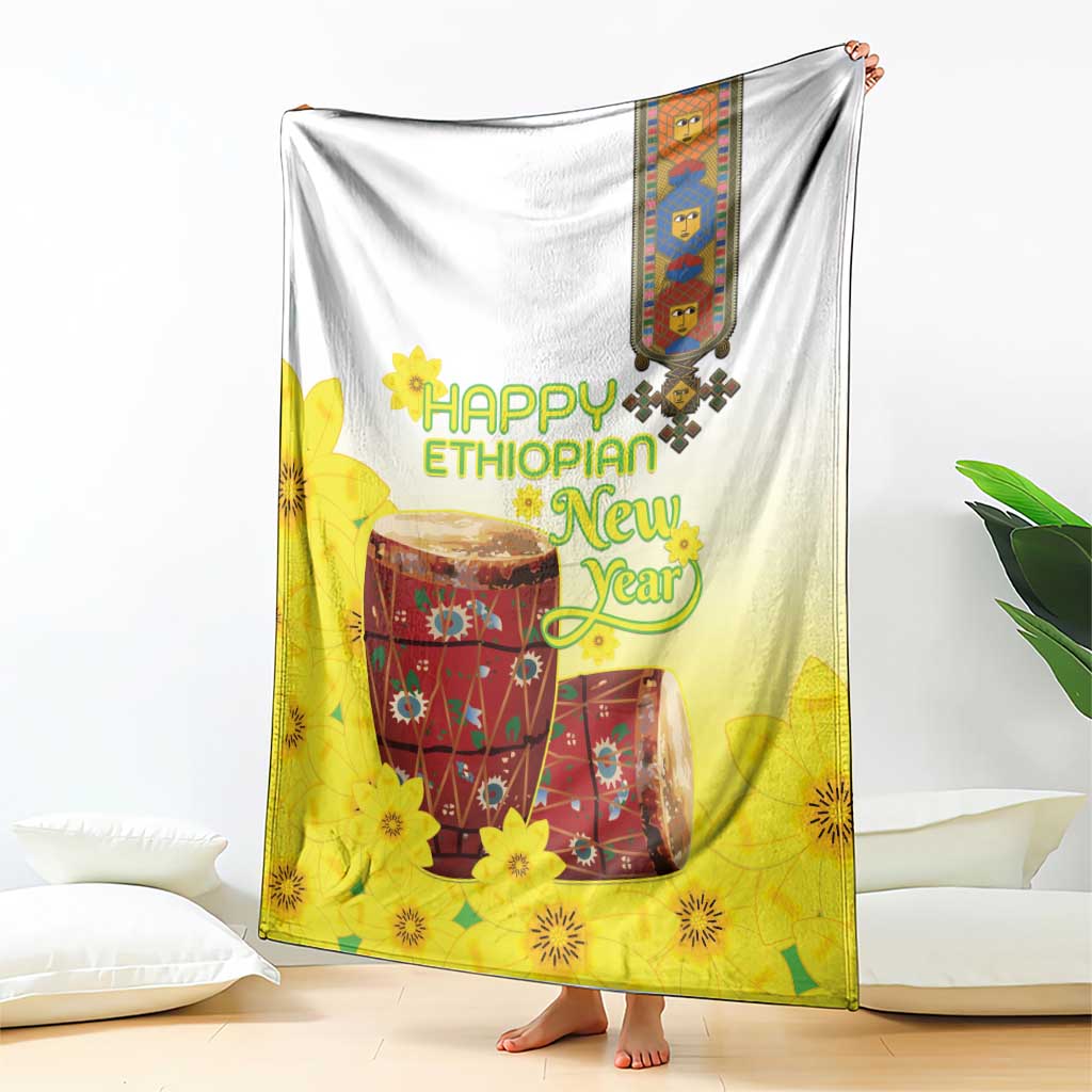 Yellow and white Ethiopian blanket with Happy Ethiopian New Year drum print, hanging