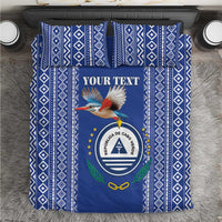 Blue patterned duvet with crest, bird graphic, and "YOUR TEXT" in central frame