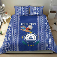 Blue patterned bedding set with geometric border, crest, bird, and "YOUR TEXT" panel