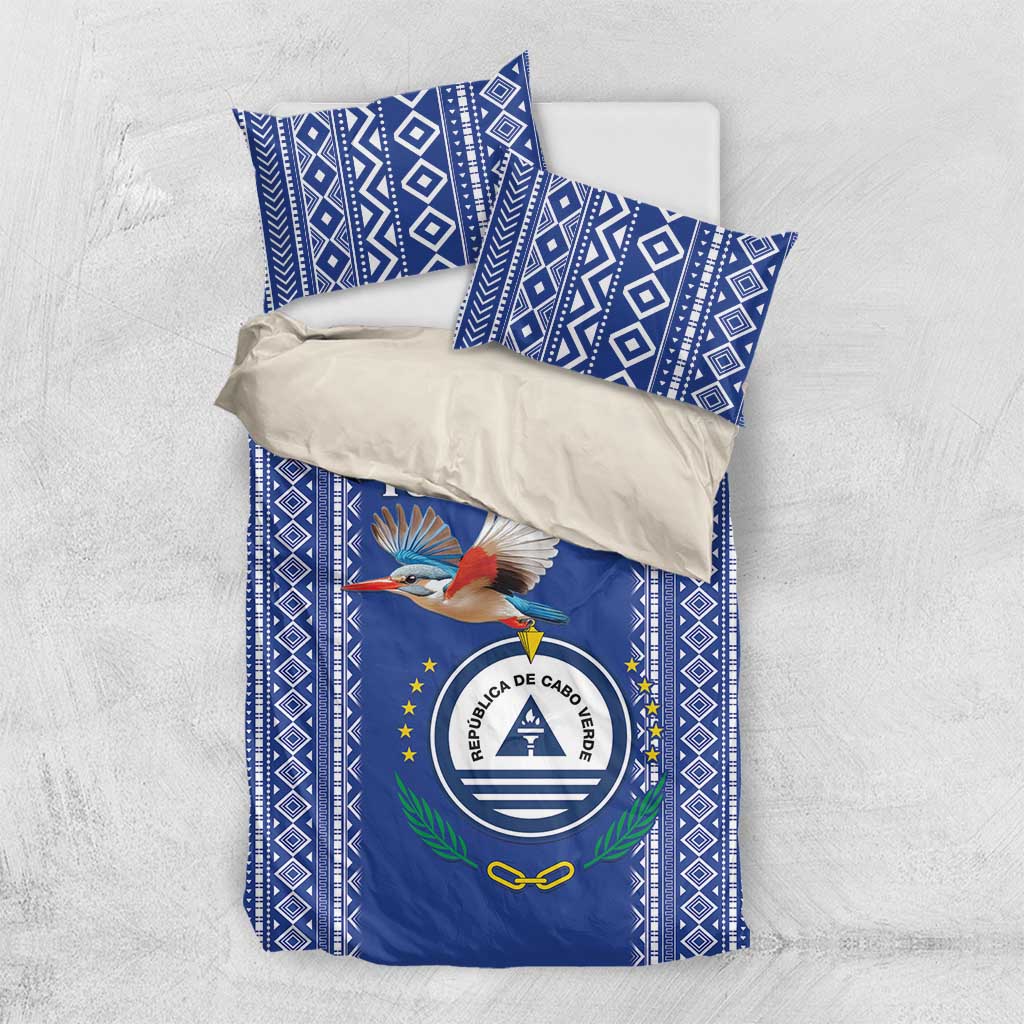 Blue patterned bedding set with crest-and-bird duvet and matching pillowcases