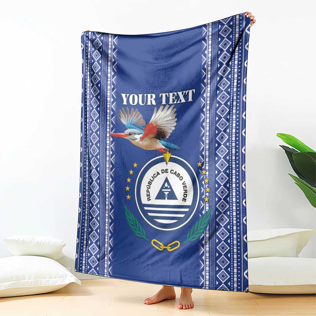Personalized blue blanket featuring bird graphic and round crest, diamond pattern border