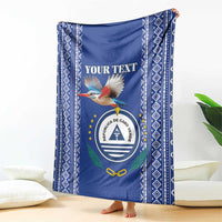 Personalized blue blanket featuring bird graphic and round crest, diamond pattern border