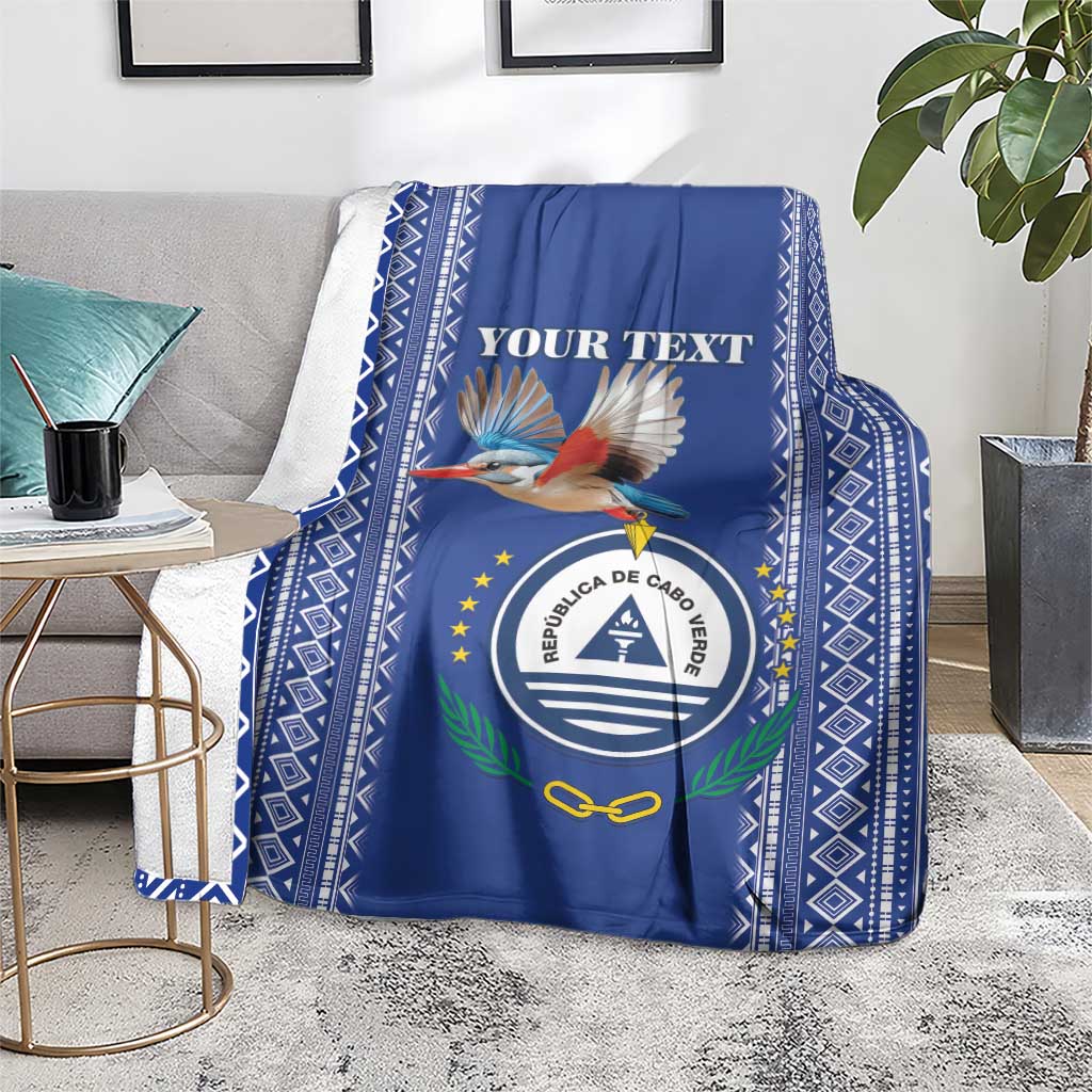 Personalized blue blanket with crest and kingfisher design, bordered with white diamond trim