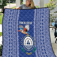 Blue quilt with diamond border and Cape Verde coat of arms center panel