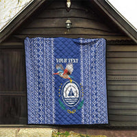 Blue quilt on wooden wall with diamond stripe border and Cape Verde crest