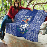 Blue quilt draped over seating, diamond border with kingfisher and Cape Verde crest