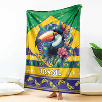 Green Brazil Christmas blanket hanging indoors, toucan centerpiece with 'BRASIL' banner.