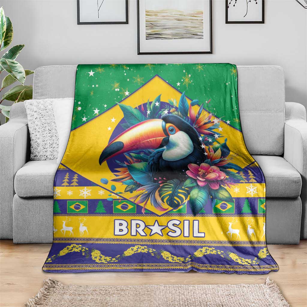 Green Brazil Christmas blanket on gray couch, toucan and 'BRASIL' design with trim.