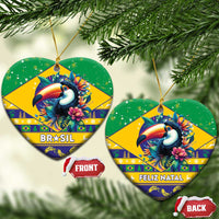Heart-shaped ceramic Christmas ornament, green and yellow toucan with Feliz Natal text.
