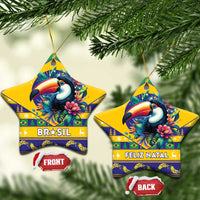 Star-shaped ceramic ornaments with toucan artwork and BRASIL and Feliz Natal text.