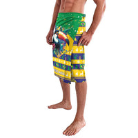 Green tropical Christmas lavalava shorts with toucan and flag-style stripe blocks