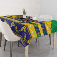 Festive tablecloth with blue, yellow, and green patterned blocks on dining table