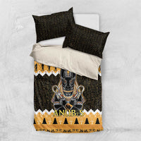 Black bedding set with Anubis jackal print, gold border, and two matching black pillowcases