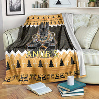 Orange and dark Anubis-themed Christmas blanket with trees, candles, and hieroglyph patterns