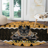 Round Anubis area rug with Egyptian symbols, dark base and orange zigzag border