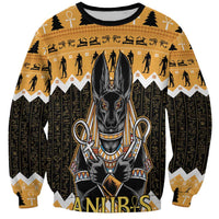 Unisex orange crewneck sweatshirt with black Anubis graphic and gold zigzag pattern