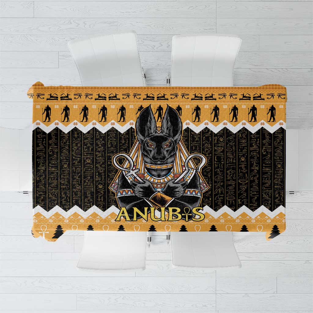 Orange tablecloth with black Anubis head and Egyptian symbol pattern