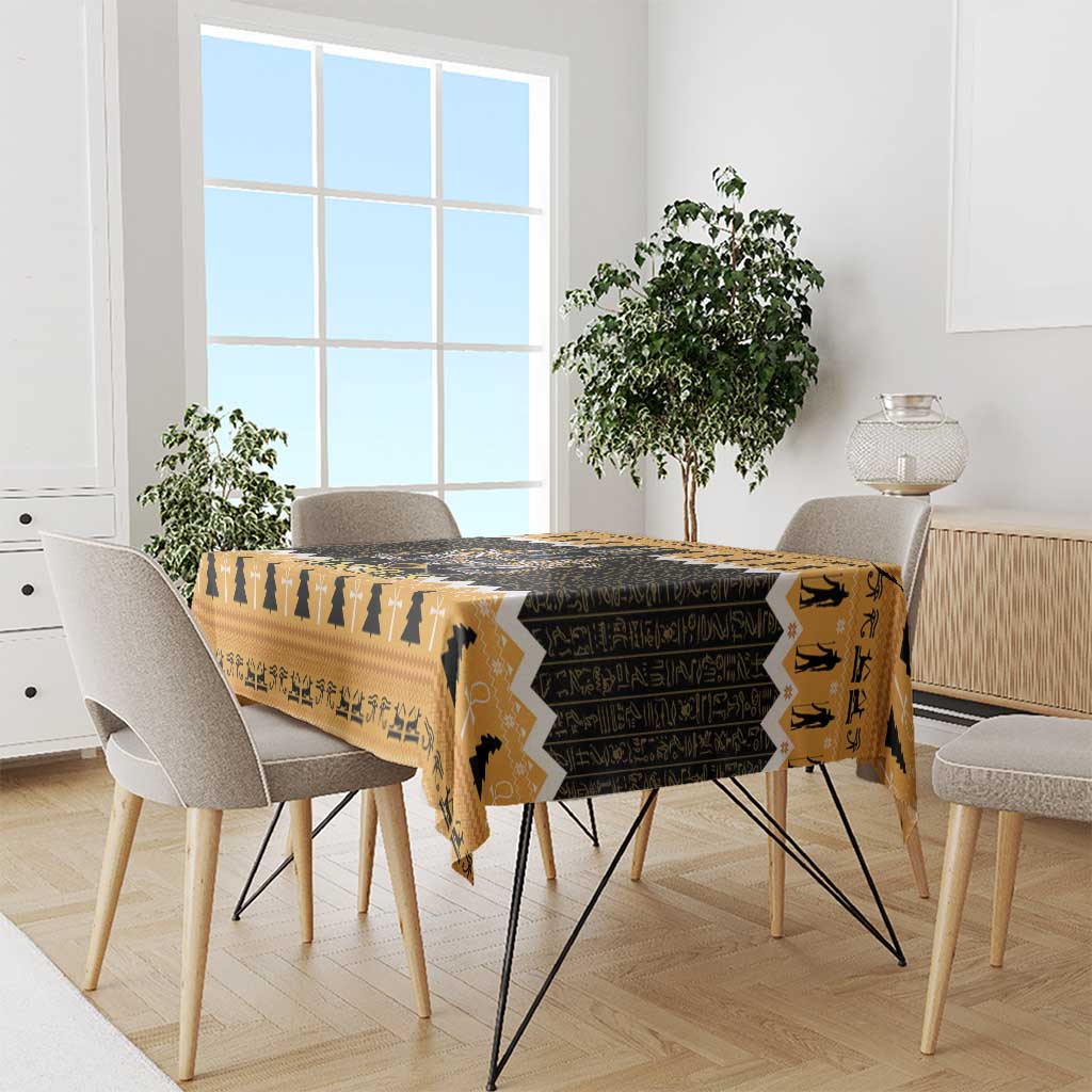 Orange and black tablecloth with Egyptian figures pattern on dining table