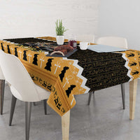 Square orange and black tablecloth with Egyptian figure and cross motifs