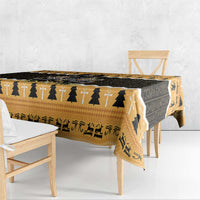 Orange and black tablecloth draped on rectangular table with Egyptian symbols