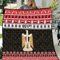 Egypt-themed quilt blanket with red, white, and black panels and gold coat-of-arms center