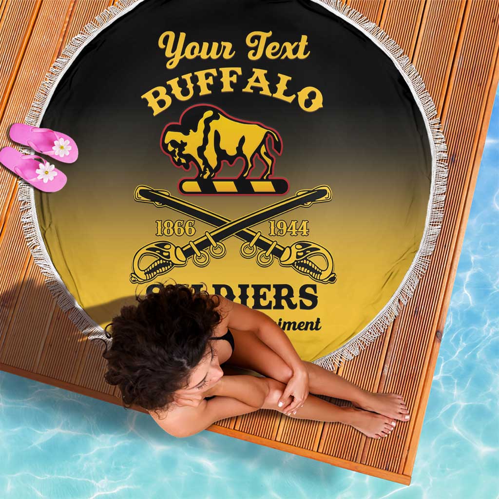 Round beach blanket with black-to-yellow Buffalo Soldiers graphic and white fringe edge