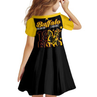 Kids short sleeve dress with yellow shoulders, black pleated skirt, Buffalo Soldiers back print